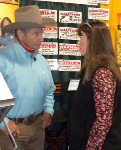 Monty Roberts stops by to speak to Debi Metcalfe in the Stolen Horse International booth. montydebi.jpg
