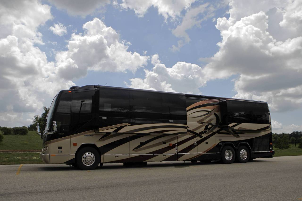 A prospective buyer takes a picture of Rita Crundwell's motor home at the Oak Creek Police Department in Oak Creek, Wisconsin. — Armando L. Sanchez, Chicago Tribune, July 27, 2012 ritacrundwellmotorhome.jpg